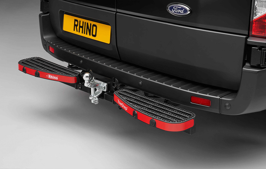 a studio photograph of a van fitted with a rhino tow step